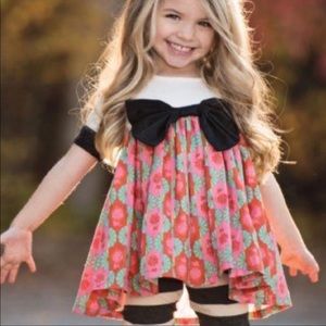 #A28——PERSNICKETY ASYMMETRICAL BOW DRESS SIZE 12